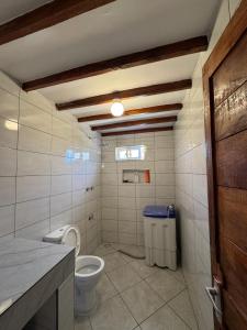 a bathroom with a toilet and a sink at Mida creek front one bedroom in Watamu