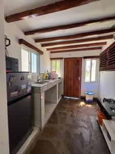 a kitchen with a sink and a counter top at Mida creek front one bedroom in Watamu +13 photos