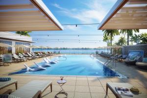 a pool at a resort with lounge chairs at The Westin Tampa Bay in Tampa