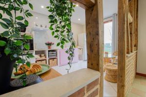 a kitchen with a table with a plate of food at La petite maison dans lusigny in Lusigny-sur-Barse