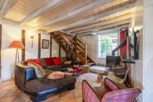 a living room with a couch and a fireplace at Sarahandia in Aldudes