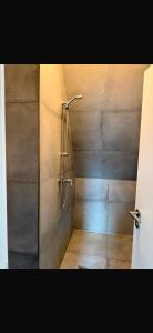 a shower stall in a bathroom with a shower at Blue Stay Bremen in Bremen +24 photos