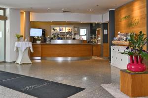 a lobby of a store with a counter and a counter at Landhotel Schnuck in Schneverdingen +74 photos