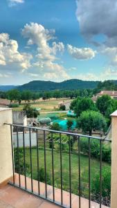 a view of a swimming pool from a balcony at Cal NEN PAU in Sant Boi de Lluçanès