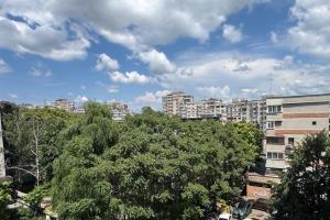 a view of a city with tall buildings and trees at Dream City Center in Piteşti