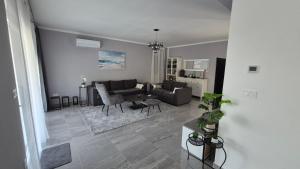 a living room with a couch and a table at Villa Aylen in Mošćenička Draga