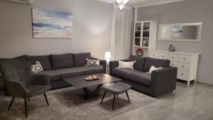 a living room with a couch and a table at Villa Aylen in Mošćenička Draga +18 photos