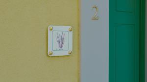 a lightswitch on a wall next to a door at Corte Pulchra - Italian Homing in Pozzolengo