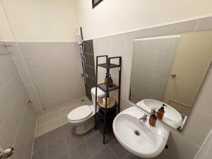 a small bathroom with a sink and a toilet at Maolao bar and hotel in Pai +17 photos