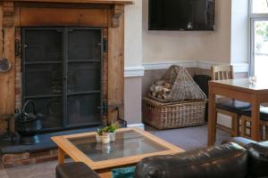 a living room with a glass table and a couch at Best Western The Royal Chase Hotel in Shaftesbury