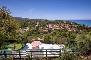 a skate park with an umbrella on top of a hill at Il Fortino Sea View in Geremèas