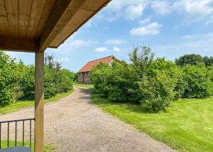 a view of a house from the porch of a house at Oak Farm Lodges in Roydon