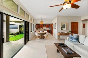 a living room with a couch and a ceiling fan at 1712 Kapalua Home in Kahana