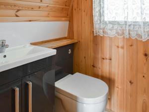 a bathroom with a toilet and a sink at Manx View-Uk1396 in Corney