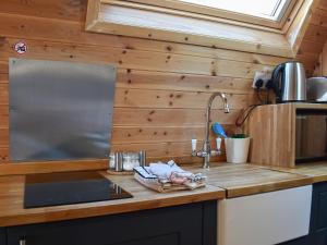 a kitchen counter with a sink in a tiny house at Black Coombe-Uk1392 in Corney