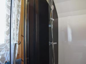 a shower with a glass door in a bathroom at Black Coombe-Uk1392 in Corney +7 photos