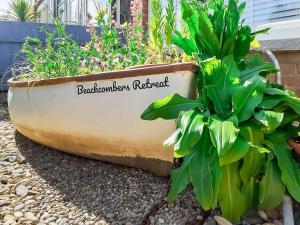 a planter with plants in it on the ground at Beachcombers Retreat in Felixstowe