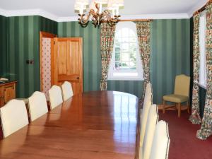 a dining room with a table and chairs at Hall Teasses Lodge - Uk52175 in Leven +16 photos