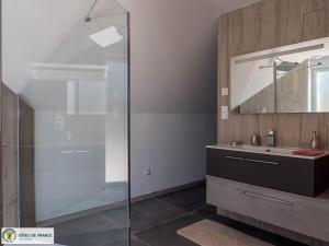 a bathroom with a glass shower and a sink at Ma Cabane in Mouret +28 photos