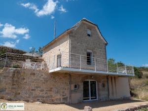 an old building with a balcony on top of it at Ma Cabane in Mouret