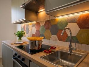 a kitchen with a sink and a counter top at Antica Dimora Donna Emma in Carini