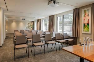 a conference room with chairs and a table and windows at GAIA Hotel Basel - the sustainable 4 star hotel in Basel