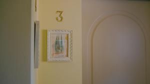 a hallway with a number on the wall at Corte Pulchra - Italian Homing in Pozzolengo