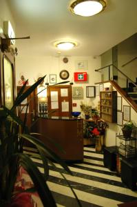 a living room with a hallway with a striped floor at Hotel Major in Genova
