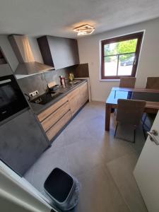 an overhead view of a kitchen with a table and a counter at GR ooms Rents in Gemmrigheim