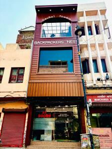 a building with a sign that reads backpackers neccessaries msg at Backpacker's Nest in Amritsar