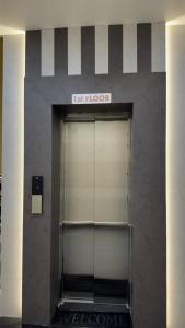 a door in a building with a sign on it at Hotel Gatik Inn in Sānāwad