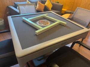 a table with a tray on top of it at 寧靜の家A區14人Villa專暑獨棟隱私無憂 in Hengchun South Gate