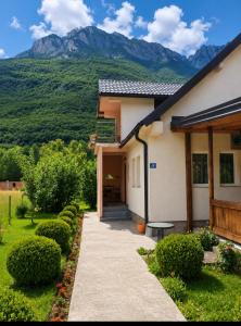a house with a view of a mountain at Breti's GuestHouse in Vusanje