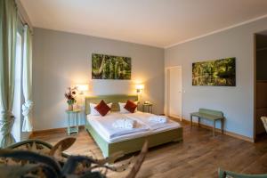 a bedroom with a bed with two pillows at Seehotel Burg Spreewald in Byhleguhrer Kaupen +48 photos