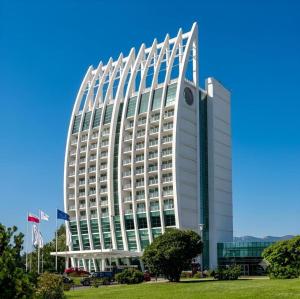 a large white building with a clock on it at Dpto central y remodelado in Valdivia