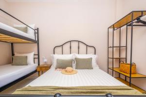 a bedroom with two bunk beds with a plate on it at Rocabella Home in Kriopigi