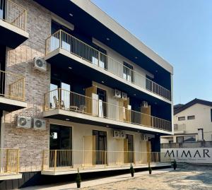 a building with balconies on the side of it at Mimar Boutique in Eforie Sud