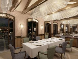 a dining room with a white table and chairs at Orient Express Venezia in Venice +109 photos