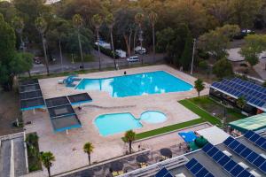 an overhead view of a pool at a resort at Kampaoh Lisboa in Lisbon +62 photos