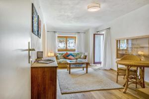 a living room with a couch and a table at Ferienwohnung Sophie in Ruhpolding