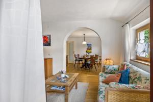 a living room with a couch and a table at Ferienwohnung Sophie in Ruhpolding