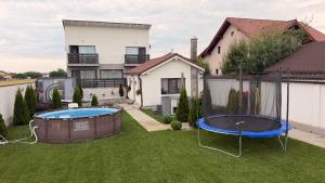 a yard with a pool and a house at Casa Valentina in Cristian