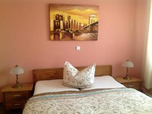 a bedroom with a bed with a pillow on it at Hotel & Gasthaus Forelle in Thale