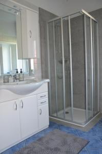 a bathroom with a shower and a sink at Gästehaus Manuela in Lind +20 photos