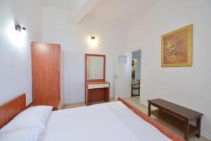 Postel nebo postele na pokoji v ubytování Windmill Villas