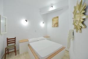 Postel nebo postele na pokoji v ubytování Windmill Villas