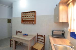 Kuchyň nebo kuchyňský kout v ubytování Windmill Villas