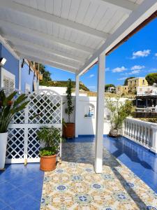 a view from the balcony of a house with a pool at Casa Simonetta Il Glicine in Ponza