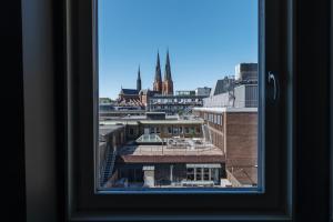 a view of a city from a window at Clarion Hotel Gillet in Uppsala