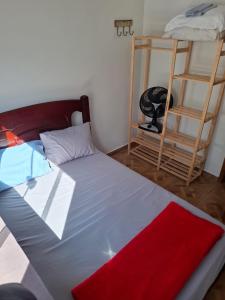 a bedroom with a bed and a bunk bed and a ladder at casa da Roberta SJB capitólio in São José da Barra